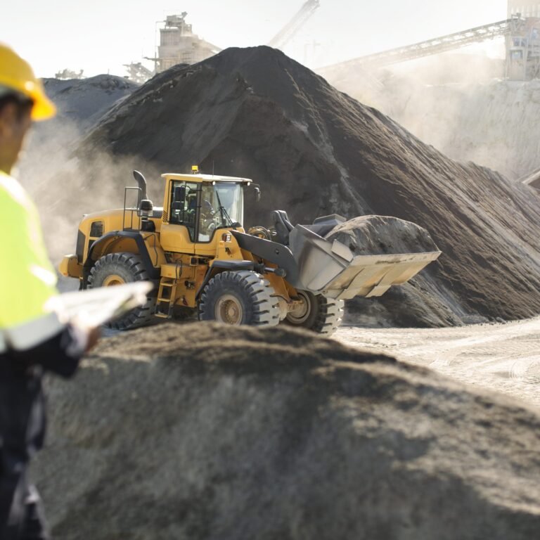 worker-standing-at-quarry-using-clipboard-2023-11-27-05-28-01-utc-scaled